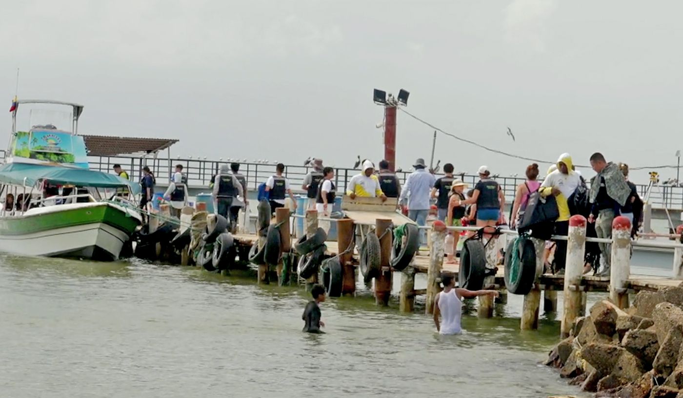 Migrants first take a ferry to other seaside towns in Colombia. They then either go on foot to the Darien Gap or take a speedboat at night to Panama to get closer.